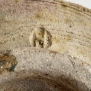 Marca de Ernst Husermann: H en un círculo.